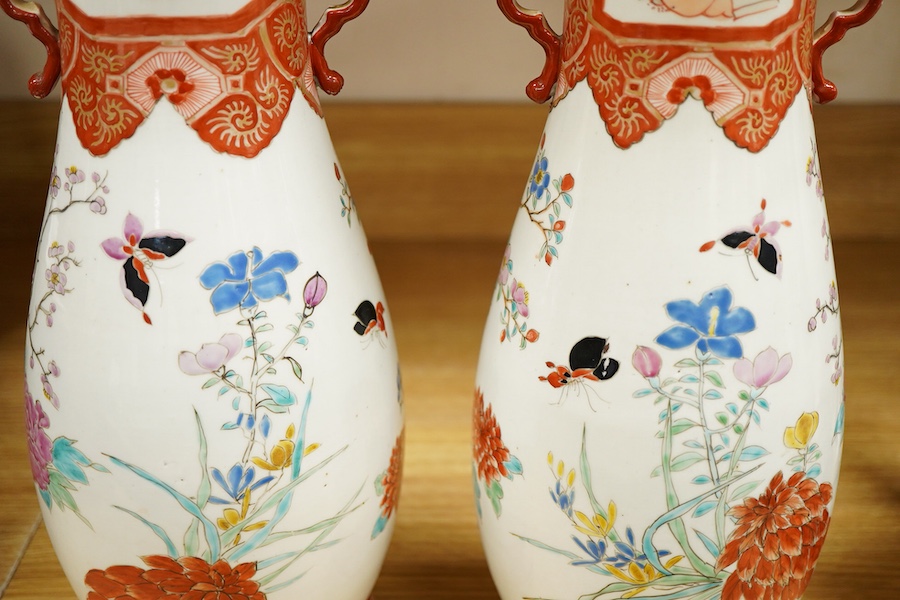A pair of Japanese Kutani two handled vases, 41cm high